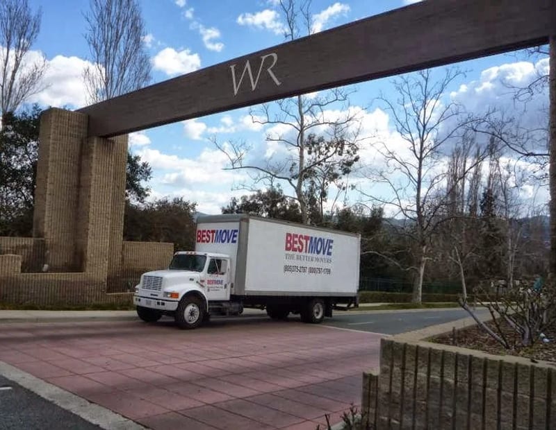 A BEST MOVE truck passing under the Wood Ranch entry monument in Simi Valley