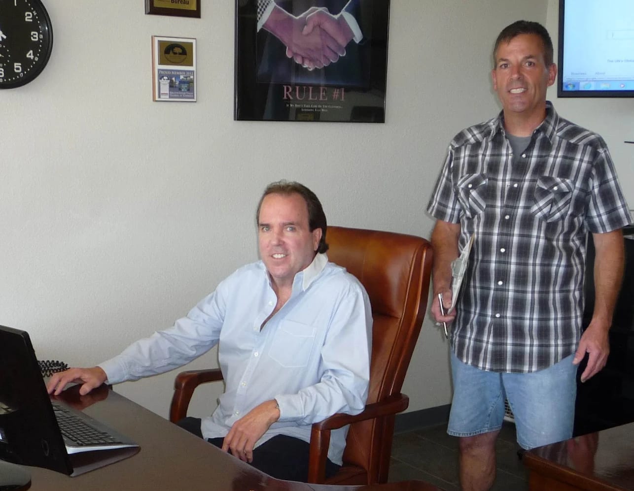 Lyn and Gary, the owners of BEST MOVE, in the Simi Valley office beneath the company's Better Business Bureau plaque
