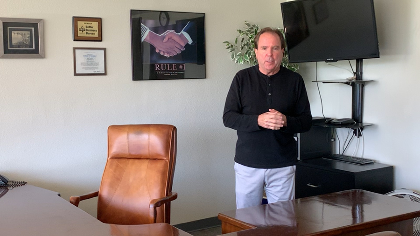 Lyn, the owner of BEST MOVE, standing in the Simi Valley office ready to speak to camera